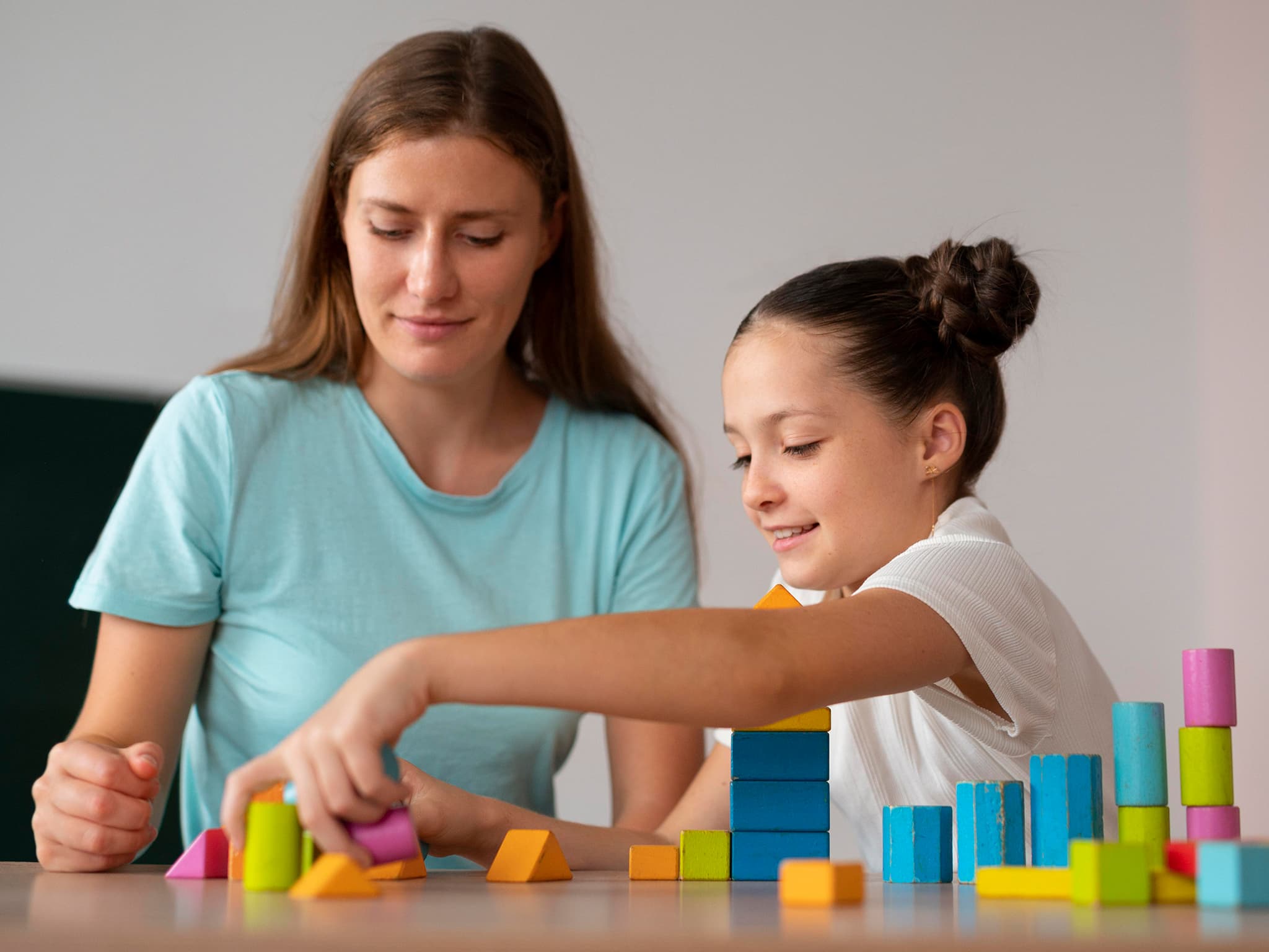 Therapist supporting a child during session